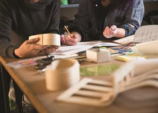 Industrial design students analyzing project