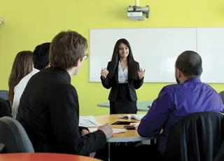 Business Administration instructor and students in a classroom