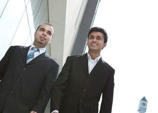 Two men wearing suits