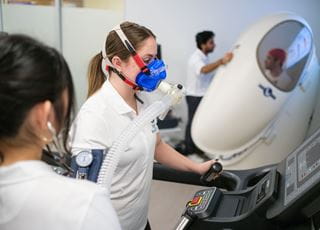 Students using equipment in a clinical kinesiology lab