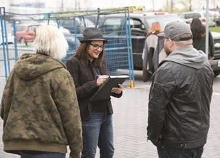 Community development worker consulting with a client