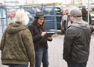 Community development worker consulting with a client