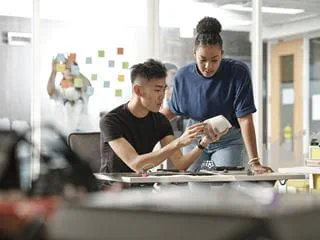 Two Sheridan students working on designing a digital product