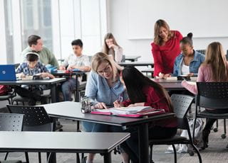 Students working in pairs in a classroom
