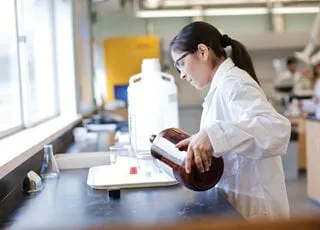 Environmental Control student mixing chemicals