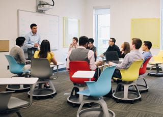 Human Resources Management instructor with students in a classroom
