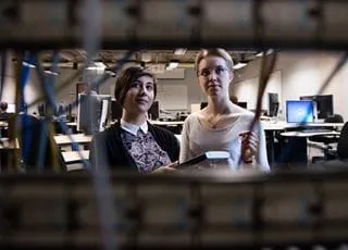 IT Support Services students looking at network cables