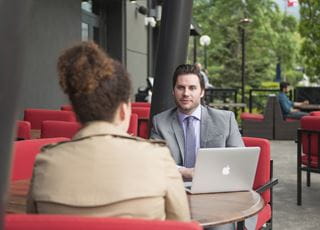 International Business students meeting in a boardroom