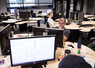 Students working on computers in a classroom