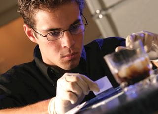 Public & Private Investigations student conducting forensic test