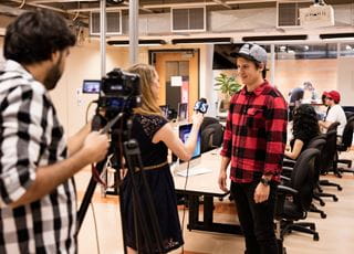 Journalism student conducting TV interview