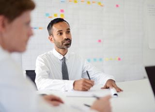 Man wearing a tie in a boardroom