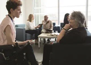 Gerontological social service worker with a client