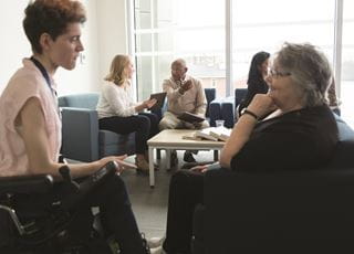 Gerontological social service worker with a client