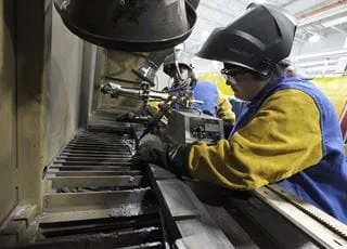 Welding student working in a lab