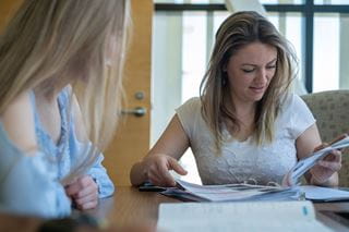 A student reading at a table