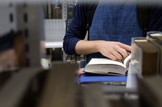 A student reading a book