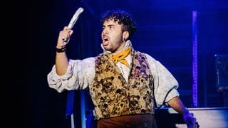 Performer in costume singing